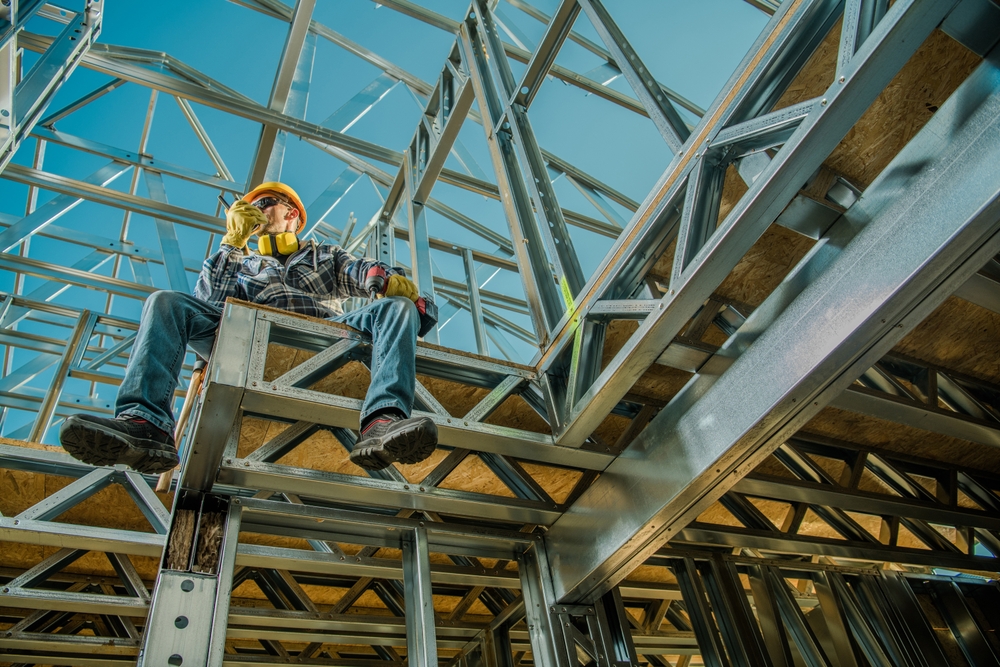 Professional,construction,worker,sitting,on,site,talking,to,his,colleagues