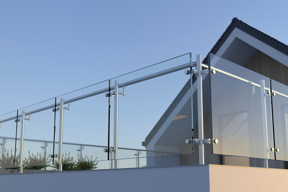 Modern,stainless,steel,railing,with,glass,panel,and,house,,3d