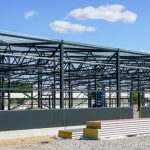 Construction,of,a,new,modern,industrial,building,,metal,truss,frame