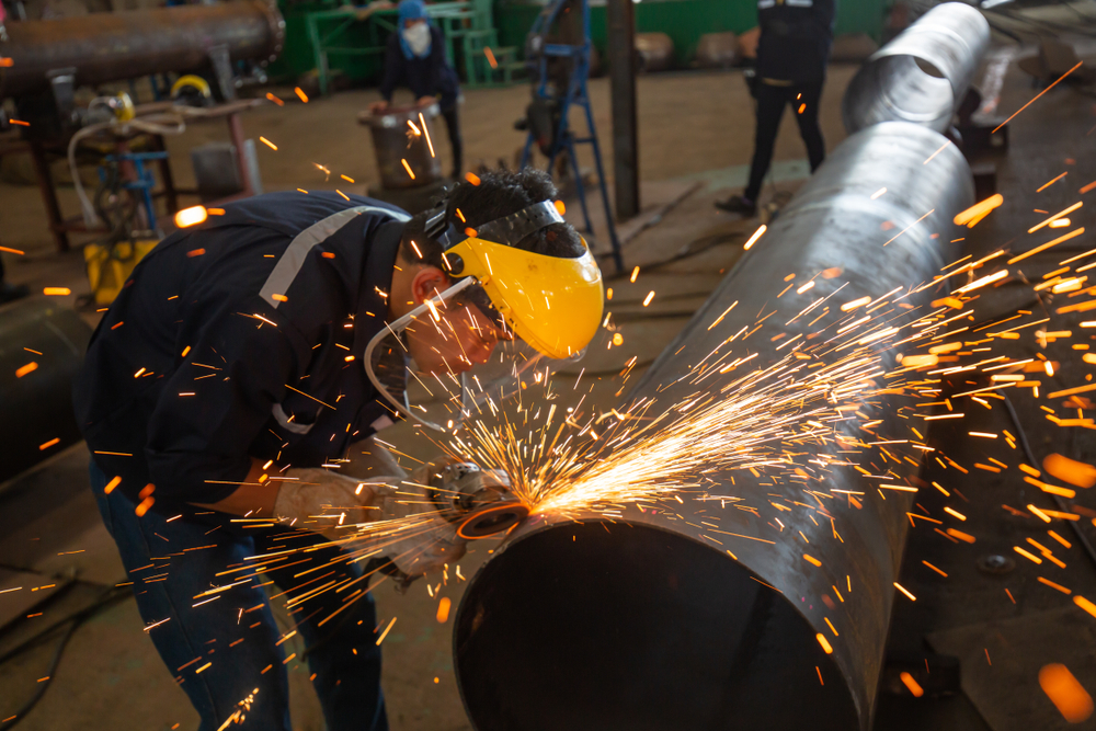 Male,worker,wearing,protective,face,clothing,and,repair,grinding,butt
